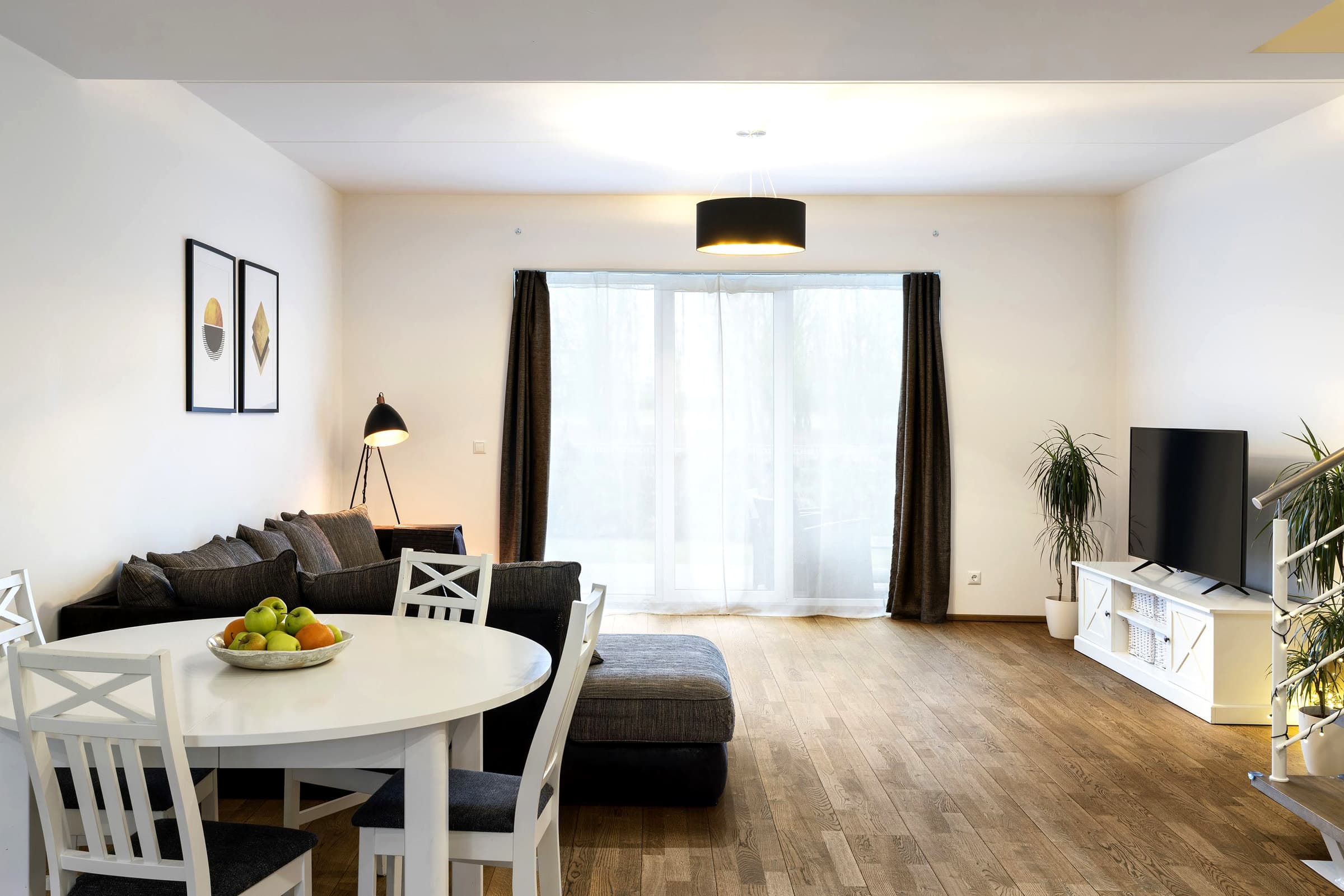 Styled living room before the kitchen.