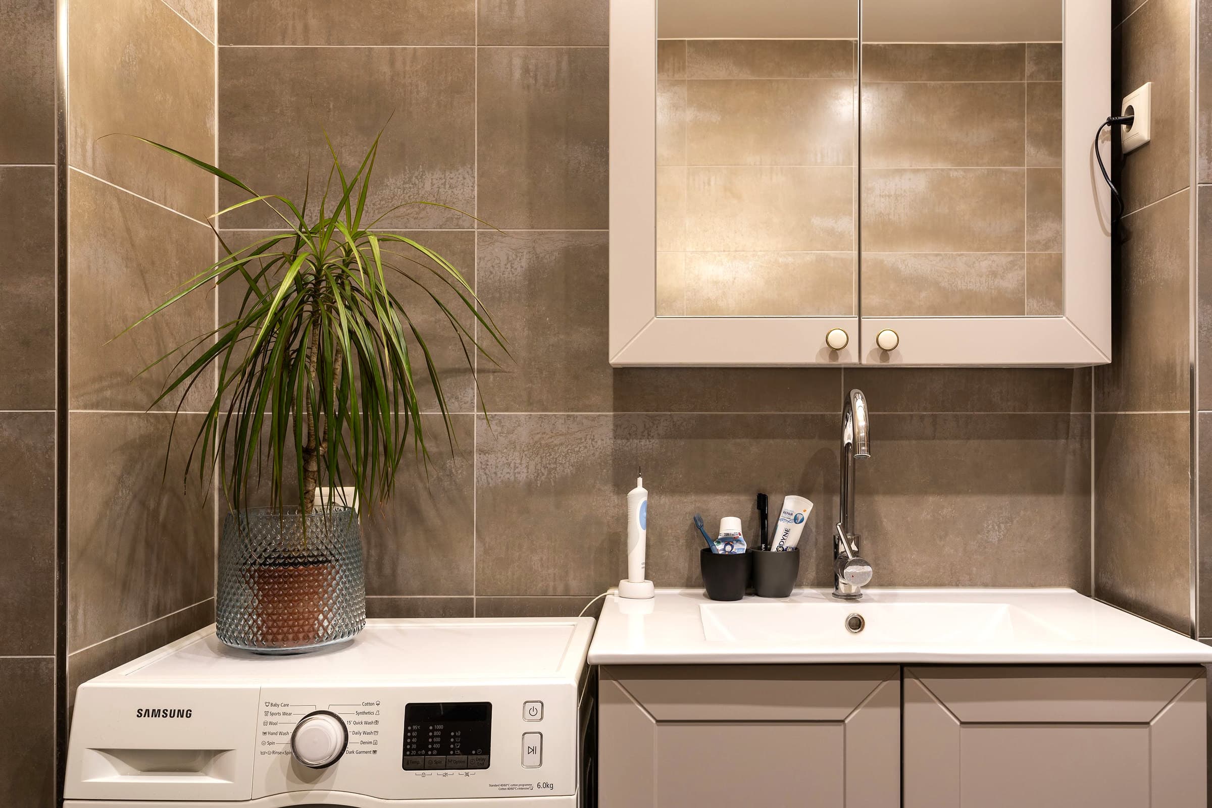 Bathroom vanity and tile detail.