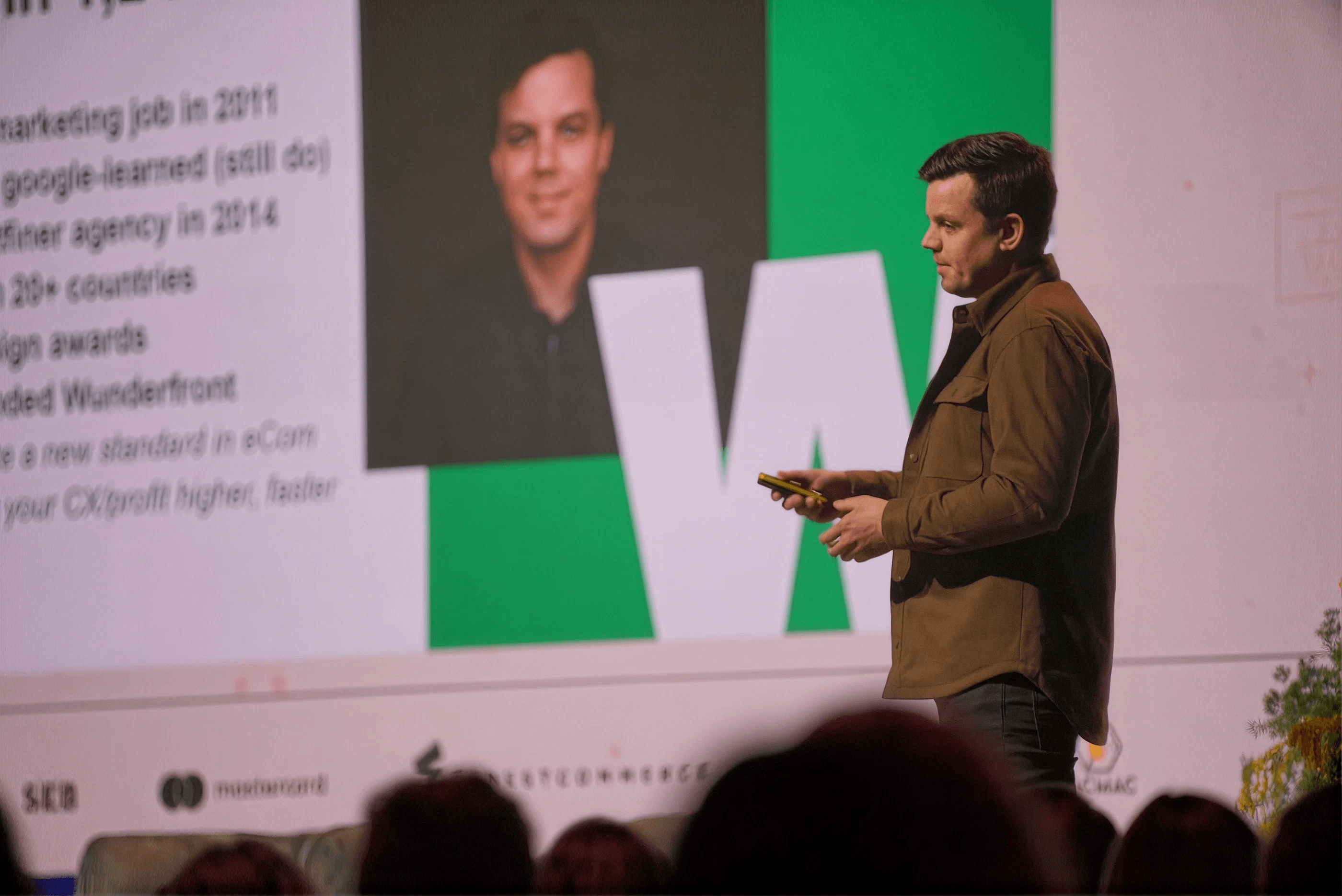 Lauri Post speaking on stage.